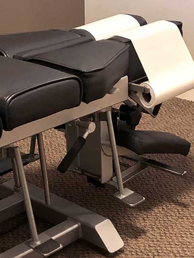 Chiropractor Dr. Roshun Glover uses the Thompson Technique and table